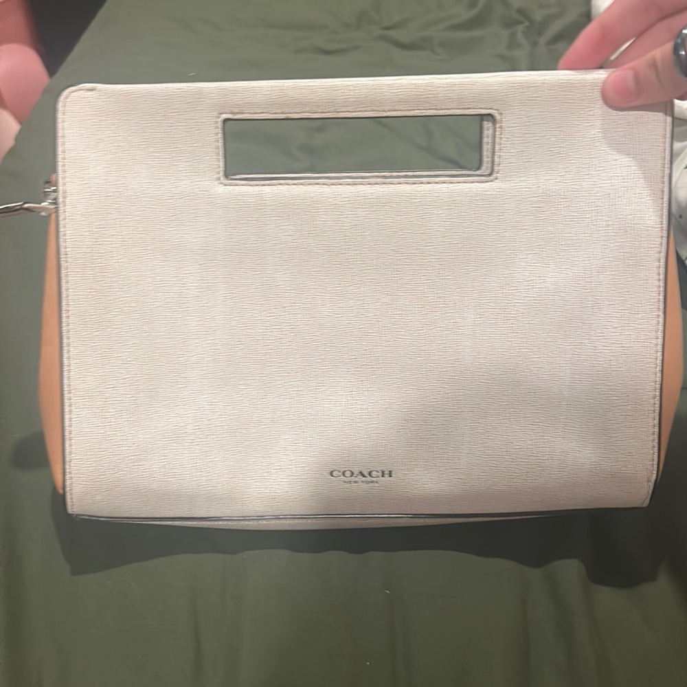 Tan coach clutch with built in handles